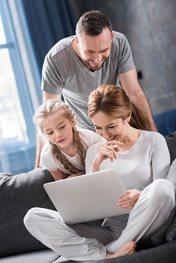 Happy family using laptop