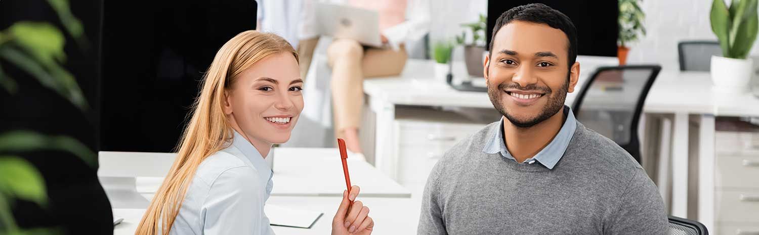 Smiling businesswoman with Indian colleague